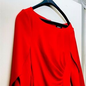 DKNY Red sheath with 3/4 tulip sleeves. Size 8. Boat neck; faux-wrap. Back zip.